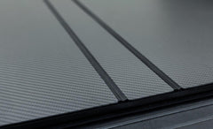 LOMAX FOLDING HARD COVER Tonneau Cover for 20-ON Chevy/GMC 2500/3500 6' 8" Box w/o Bedside Storage Box (Carbon Fiber) - Black Patch Performance - ACCEB5020099