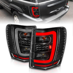 99-04 Jeep Grand Cherokee Tail Light Set - Black Patch Performance - ANZO311394